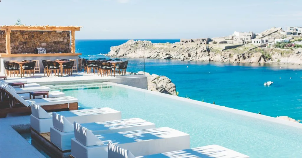 Super Paradise Beach Club pool sunbeds with party atmosphere Mykonos